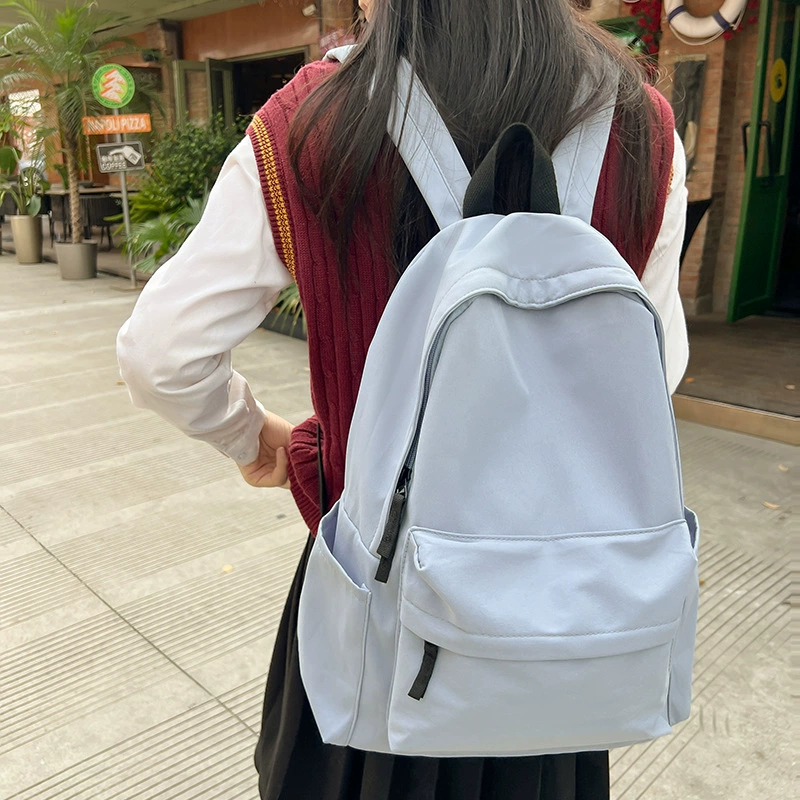 Japanese unprinted style backpack for male and female college students Korean version large capacity solid color backpack junior high school and high school student school bag